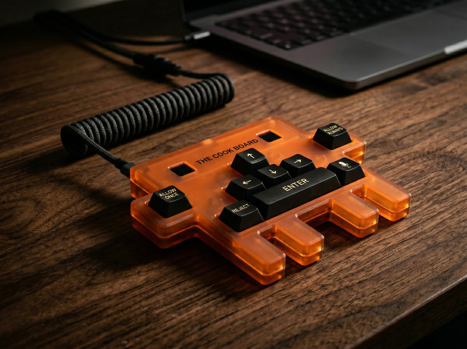 The Cook Board close-up — amber translucent case and mechanical keycaps