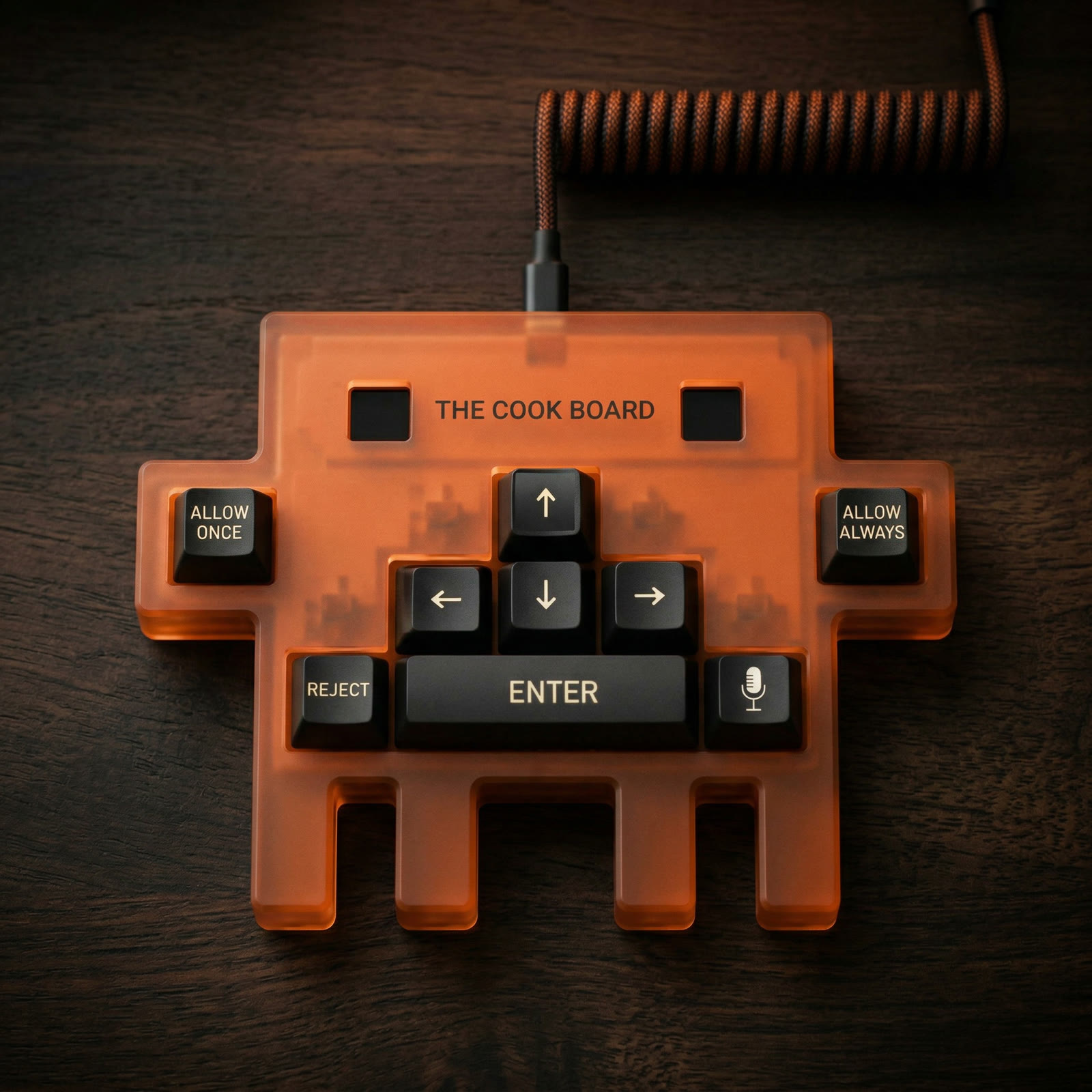 The Cook Board top-down — amber Space Invader silhouette and 8 keys